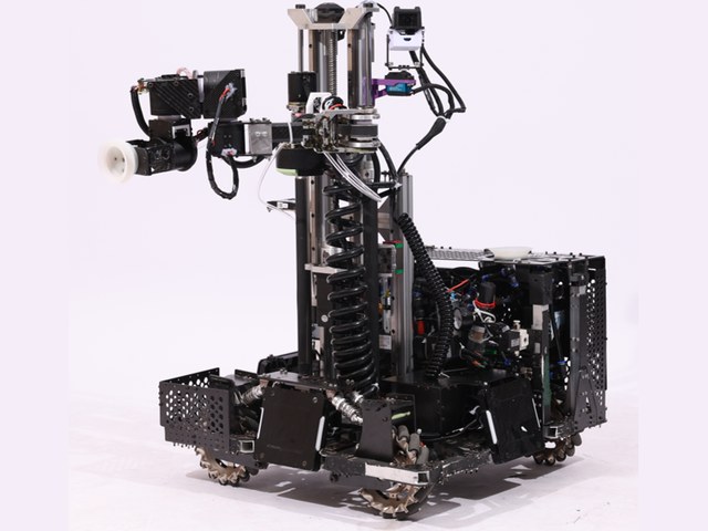 The RoboMaster Engineer robot as built, photographed against white: mecanum chassis, the vertical lift column, and the SCARA arm raised.